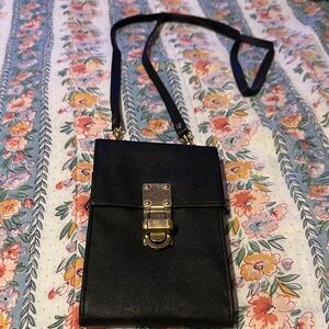 Black crossbody efficient little bag.